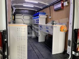 Offside van Shelving and aluminium drawers blue services case with work bench